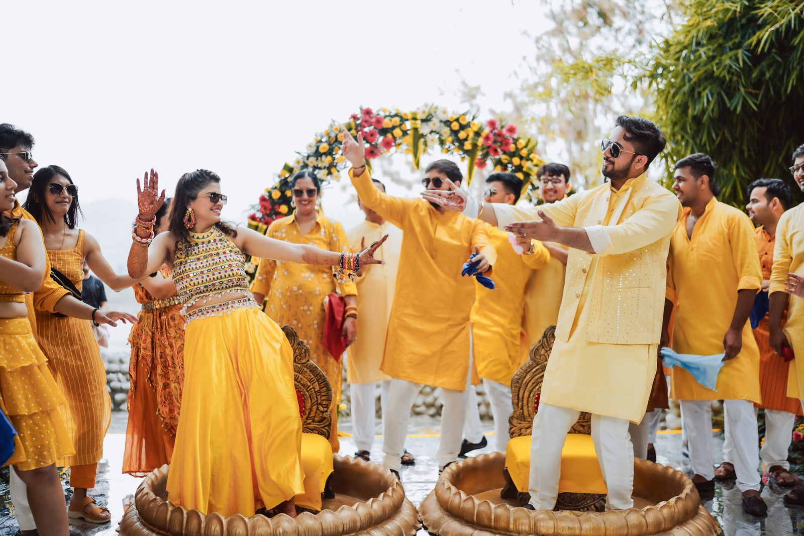Indian wedding guests dancing at an outdoor function