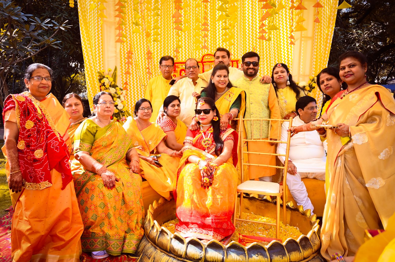 Family gathered for an Indian wedding haldi ceremony