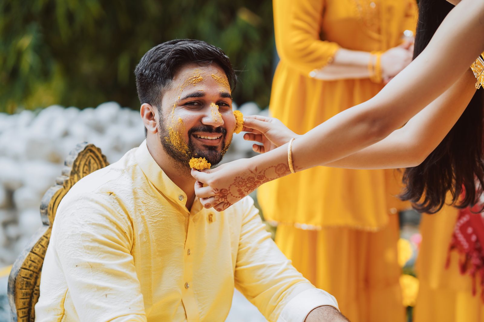 Friends celebrating together at a haldi function