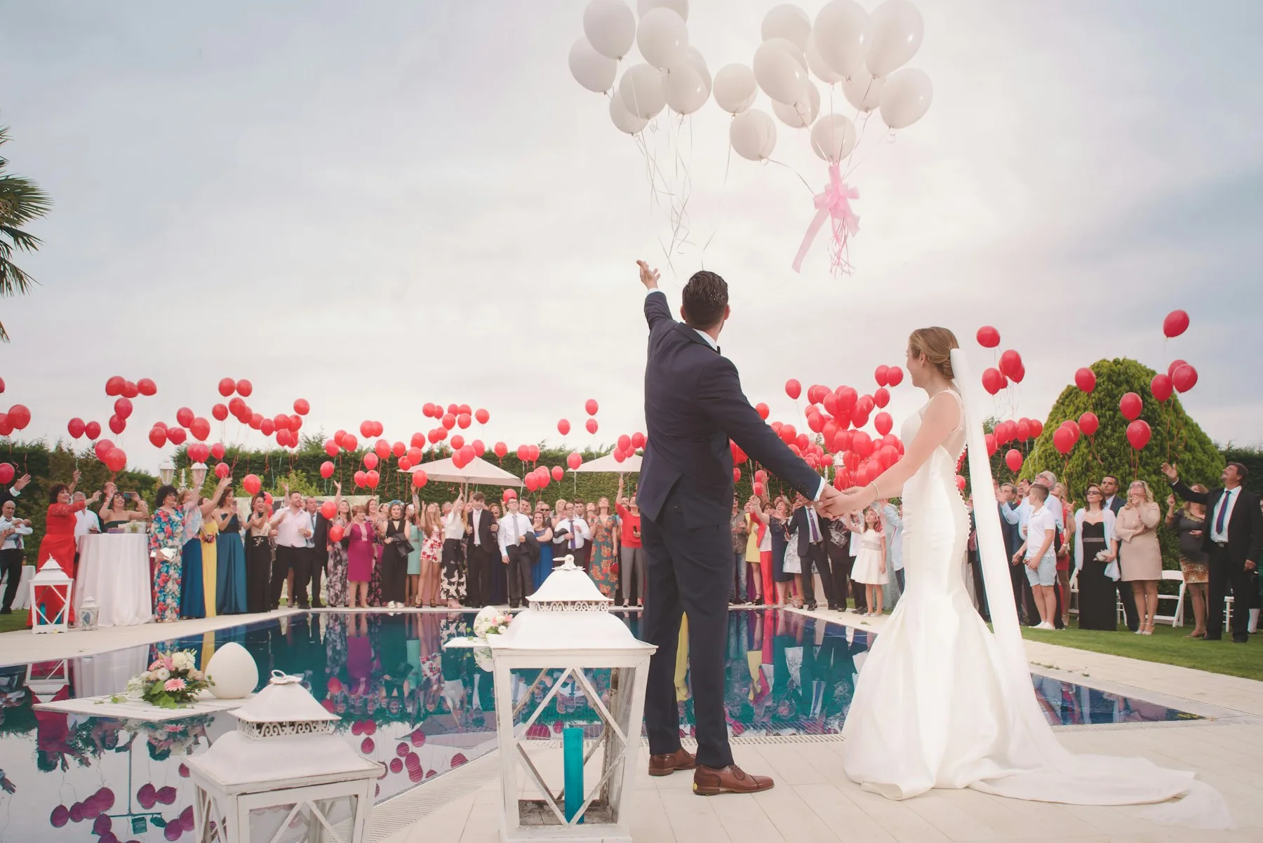 wedding guests celebrating while Picaggo collects every photo automatically — no app required
